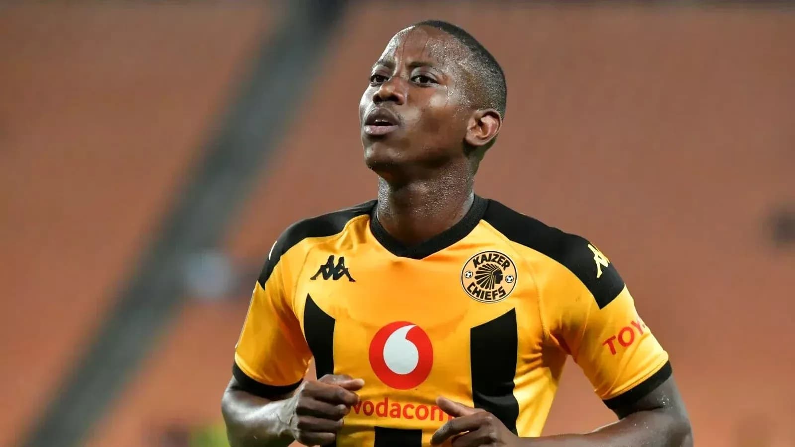 Player wearing Kaizer Chiefs jersey during match