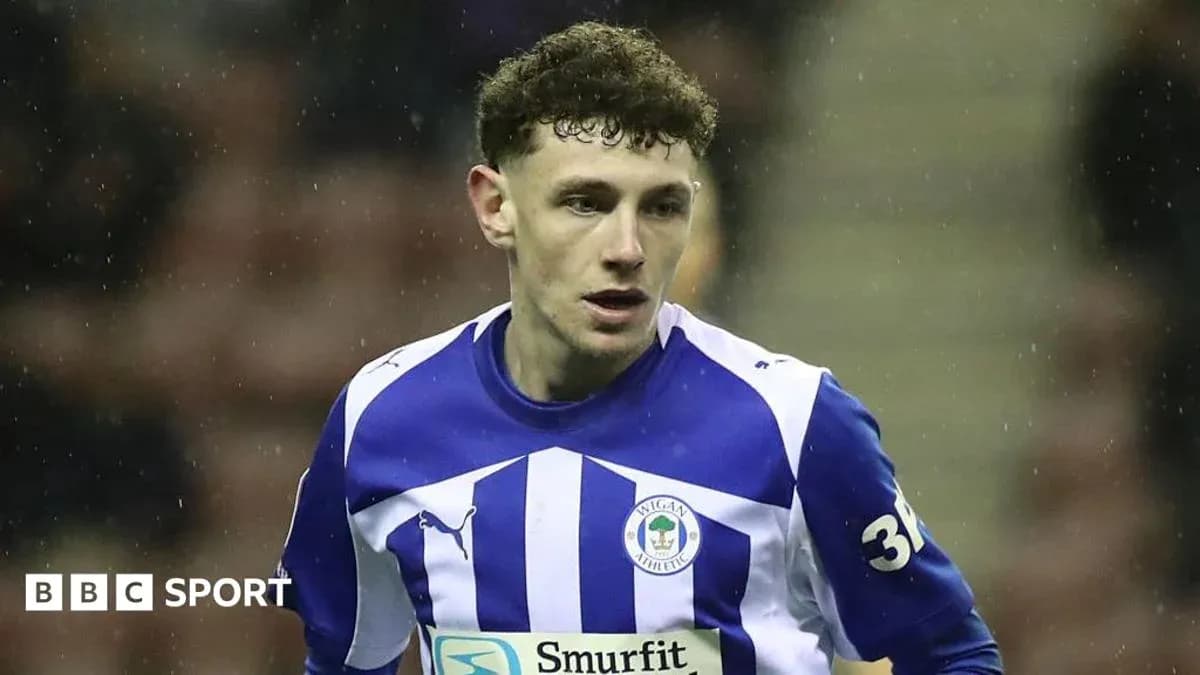 Wigan Athletic player in blue and white kit
