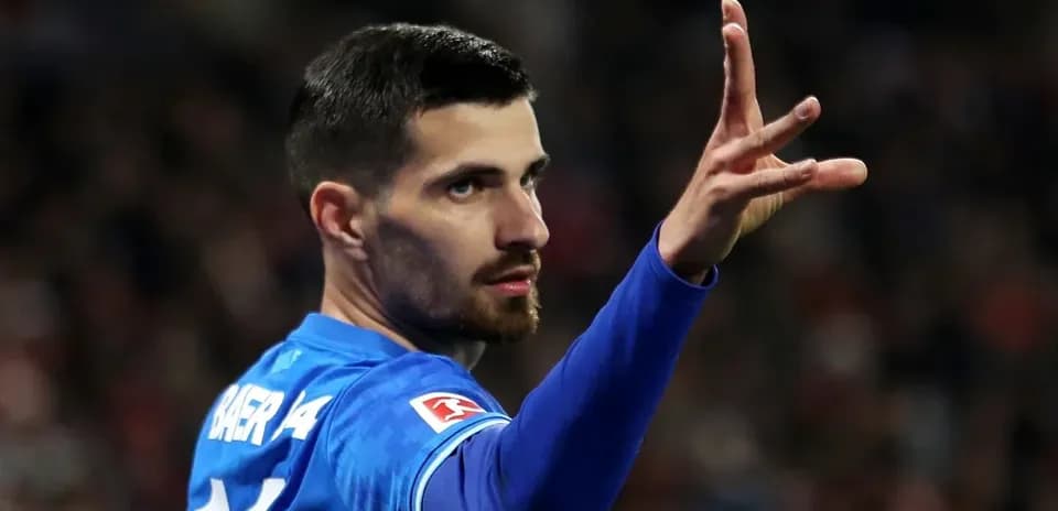 Player gesturing during a match in blue jersey