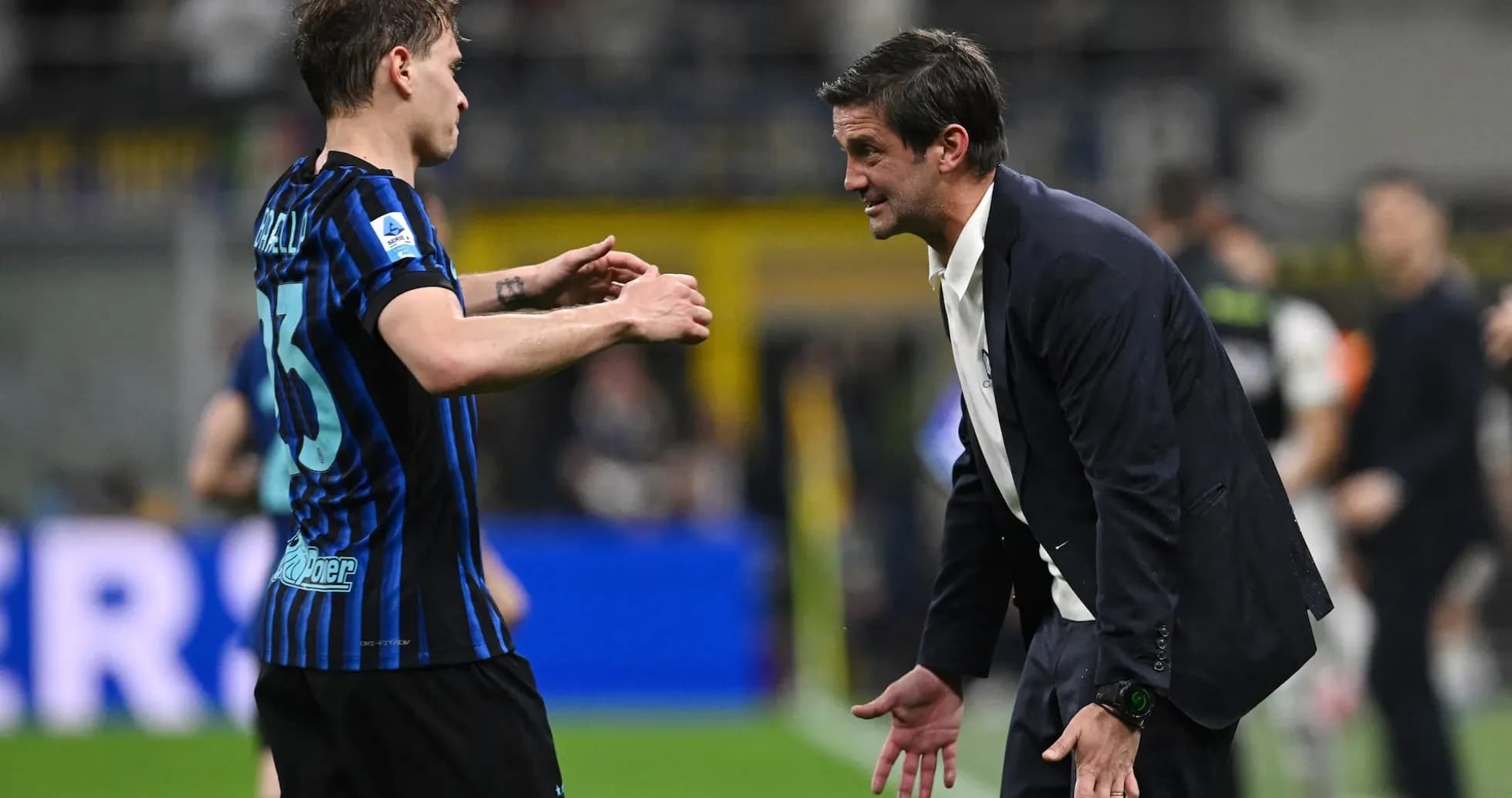 Inter player discussing with coach during match