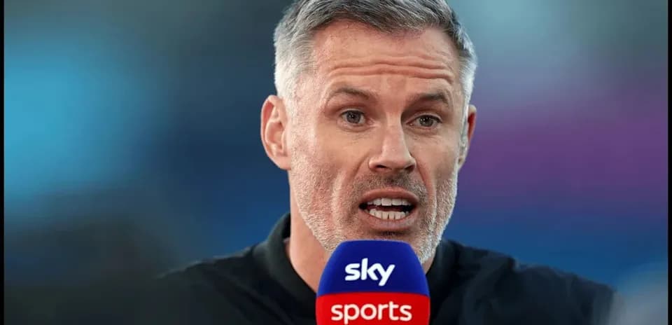 Presenter speaking into Sky Sports microphone during broadcast