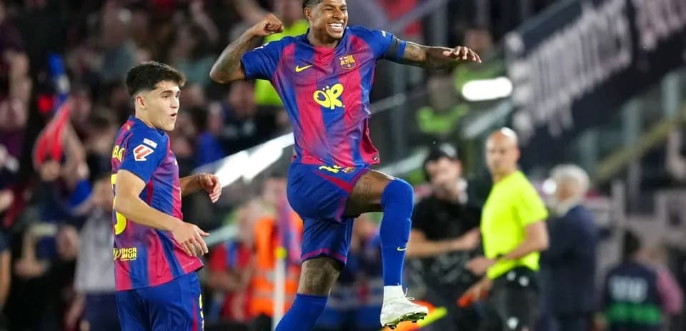 Barcelona players celebrating a goal on the field