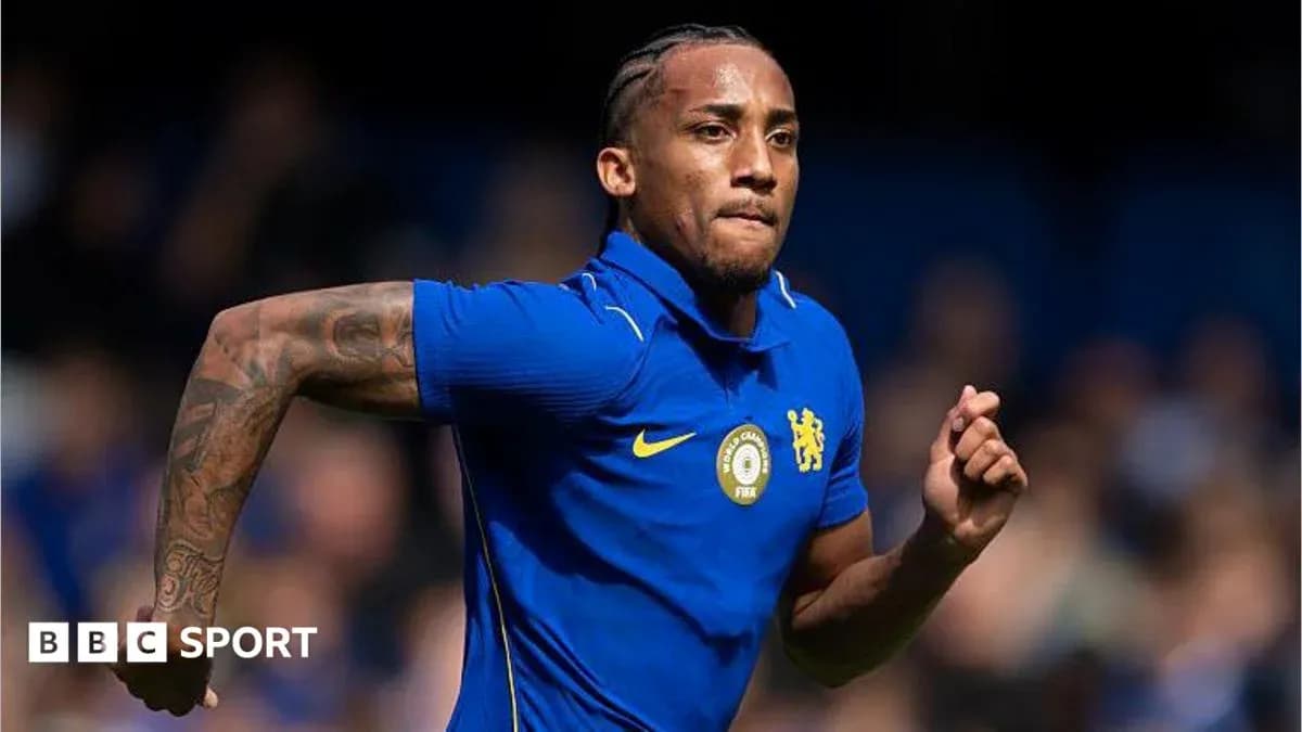 Player running in Chelsea blue kit during match