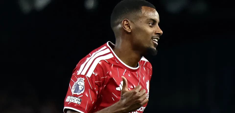 Player celebrating goal in red team jersey