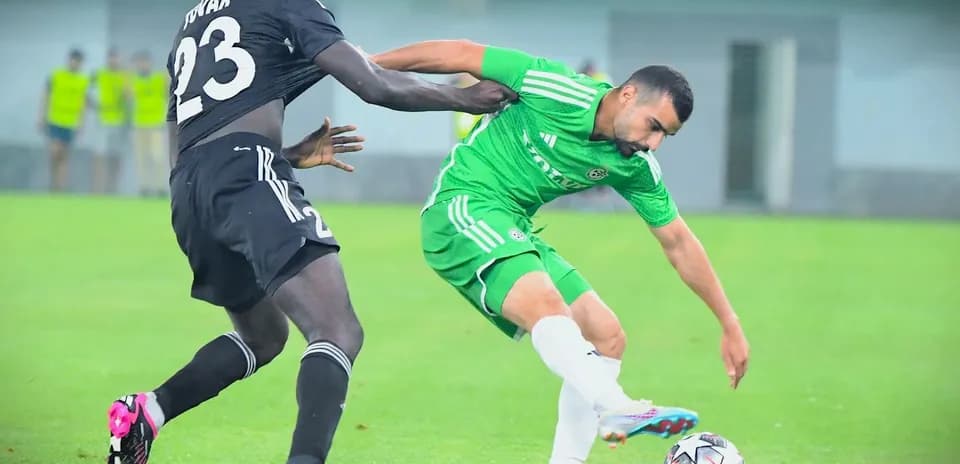 Sheriff Tiraspol player challenged by opponent