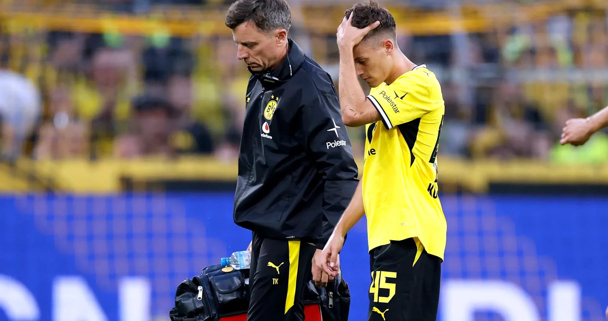 Player walking off with medical staff during match