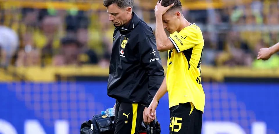 Player walking off with medical staff during match