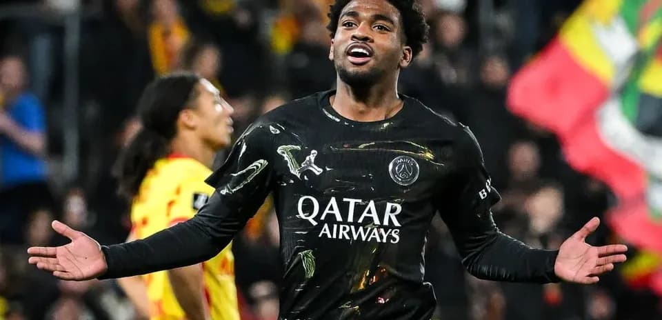 Player celebrating a goal in black jersey