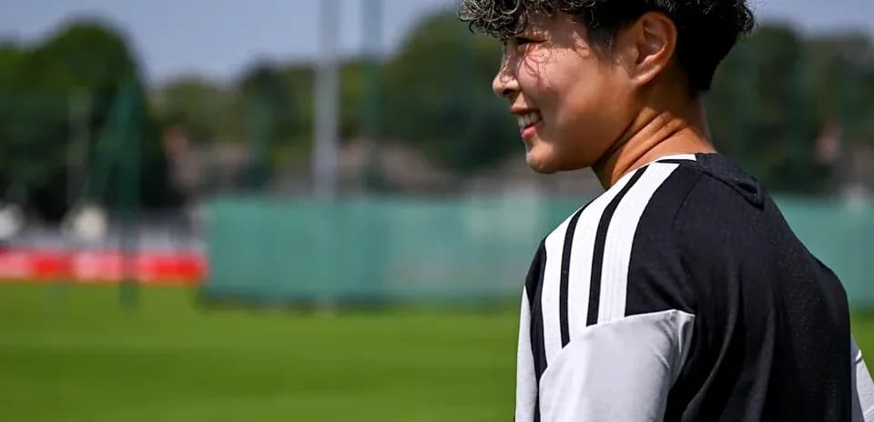 Player standing on training pitch with green background