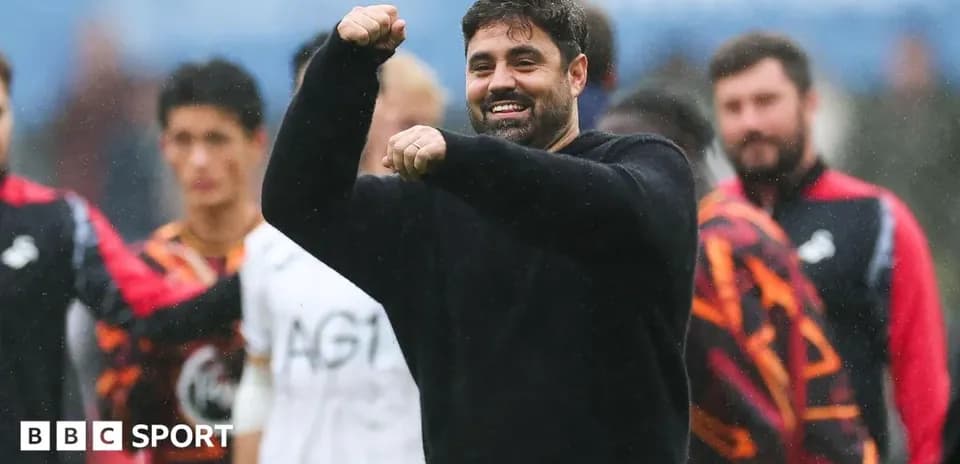 Coach celebrating with raised fist during match