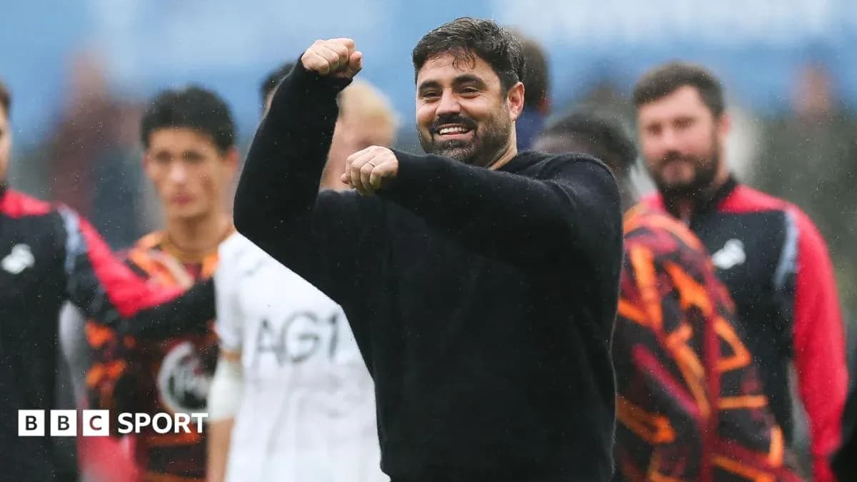 Coach celebrating with raised fist during match