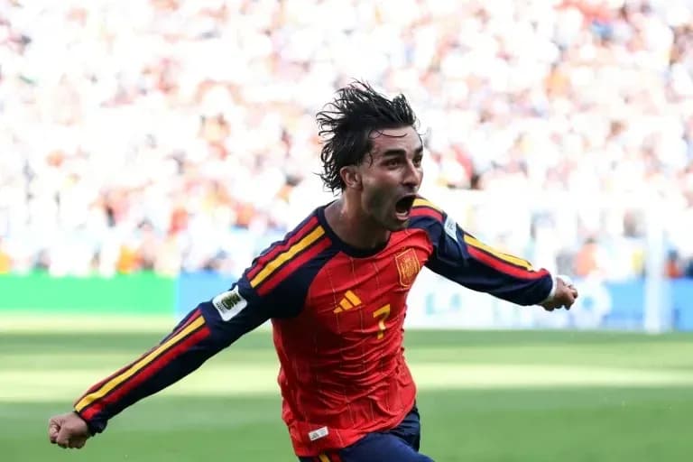 Player celebrating a goal for Spain during match
