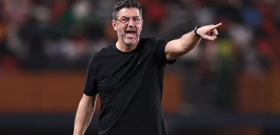 Coach instructing players during a match
