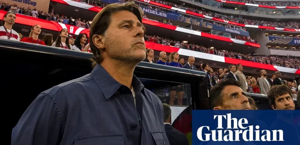 Coach standing in front of crowd during match