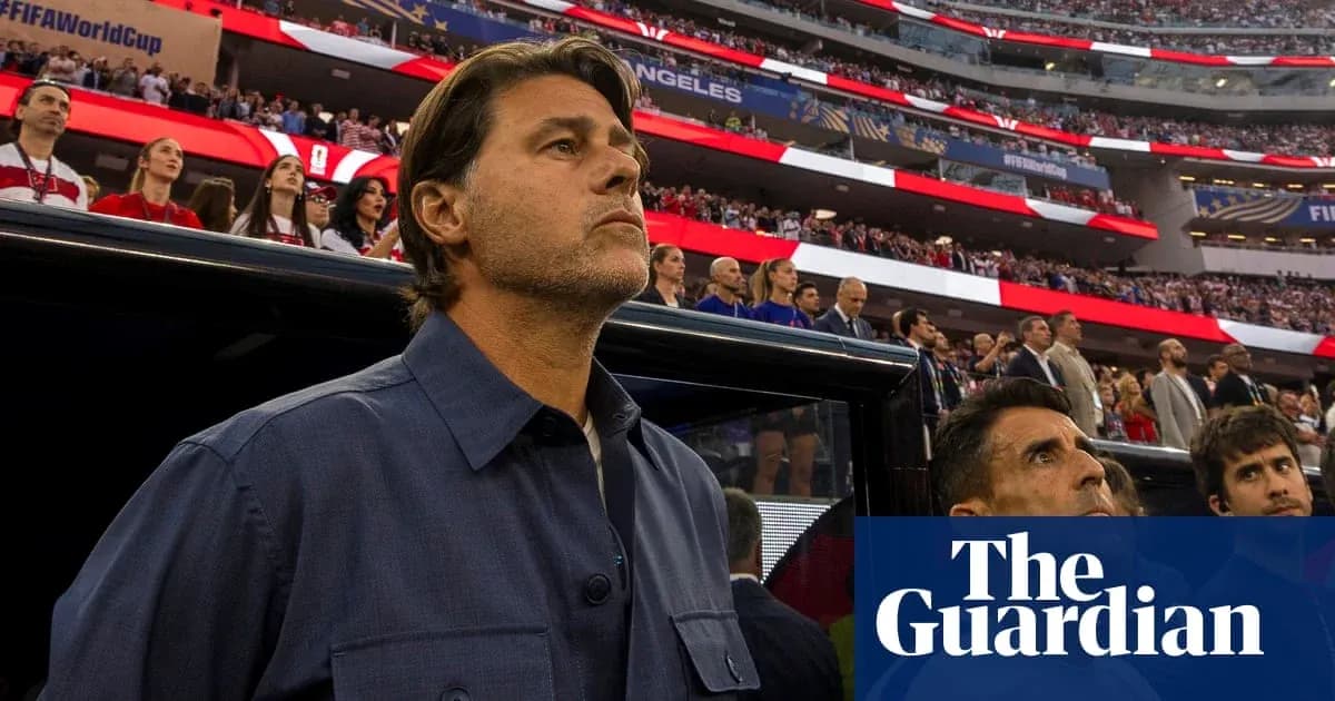 Coach standing in front of crowd during match