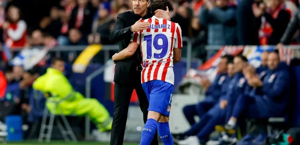 Coach embracing player during a match celebration