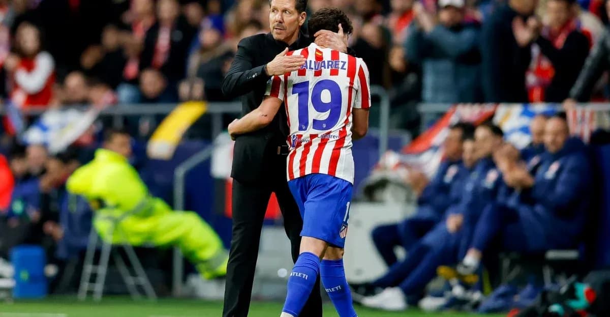 Coach embracing player during a match celebration
