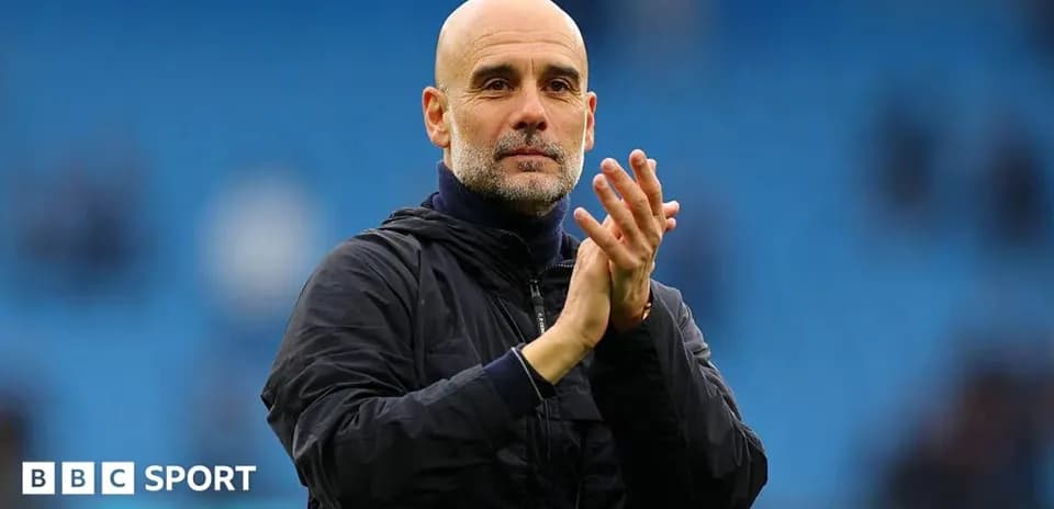 Manager clapping during match at stadium
