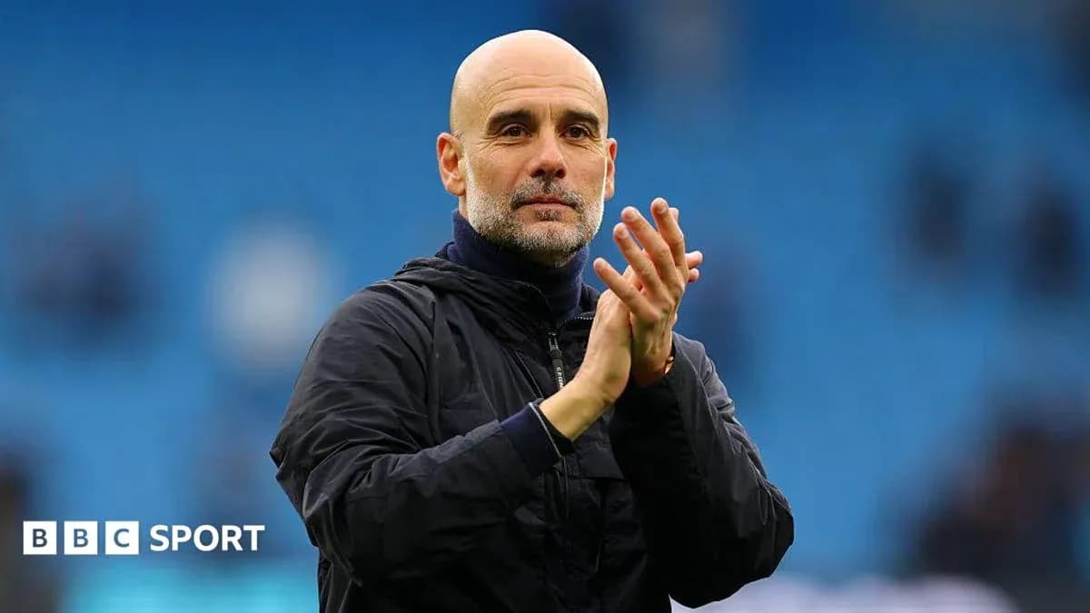 Manager clapping during match at stadium
