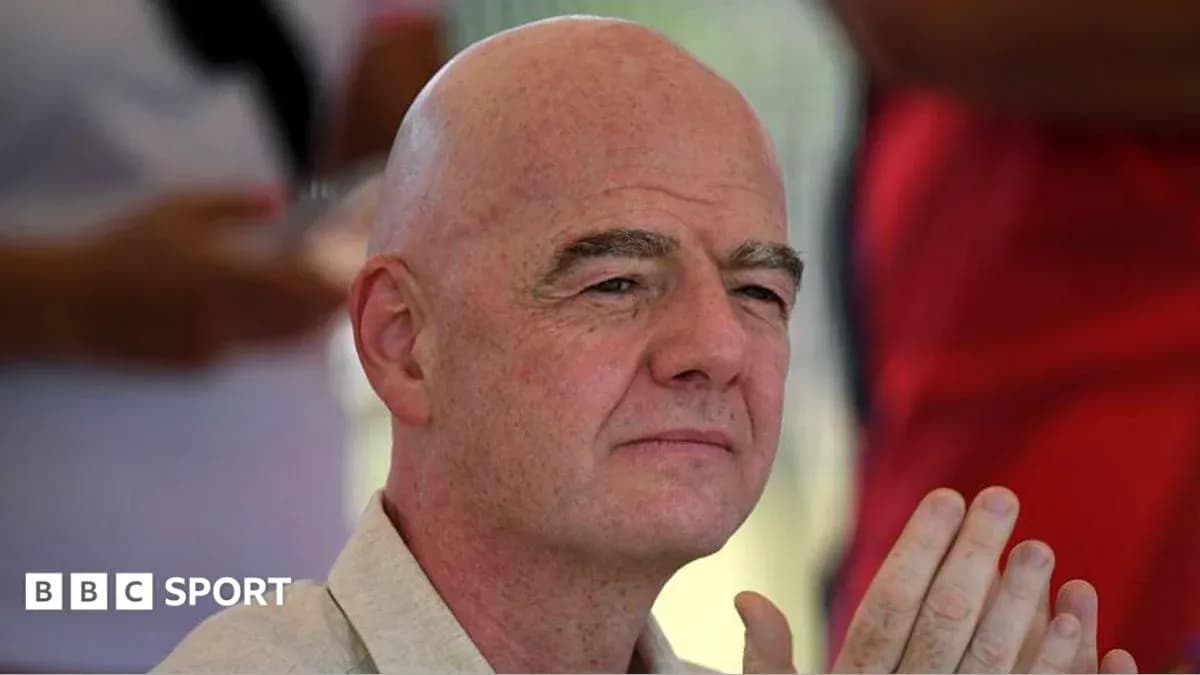 Man with bald head and hands clasped together