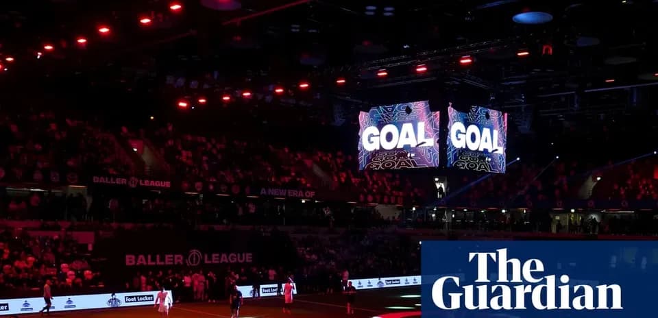 Crowd celebrating as 'GOAL' displayed on screens