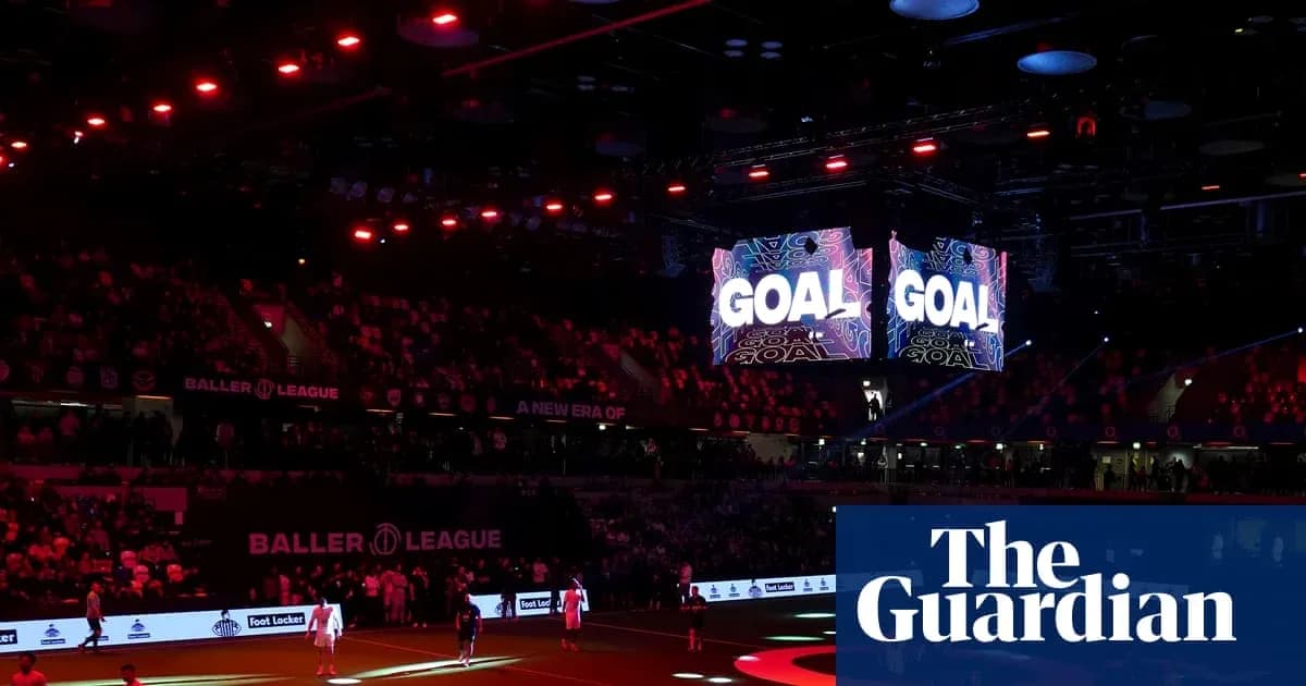 Crowd celebrating as 'GOAL' displayed on screens