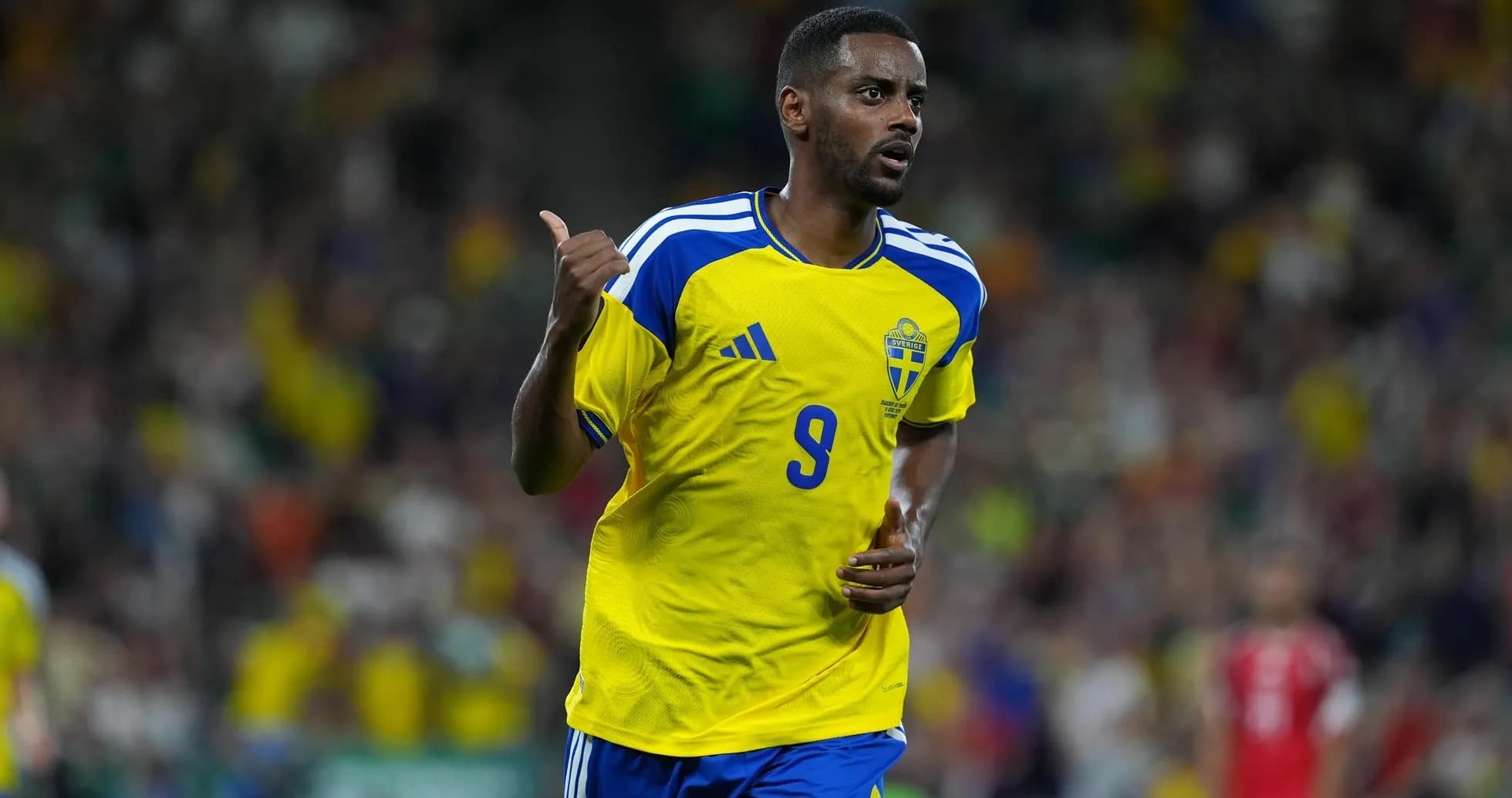 Swedish player celebrating during football match