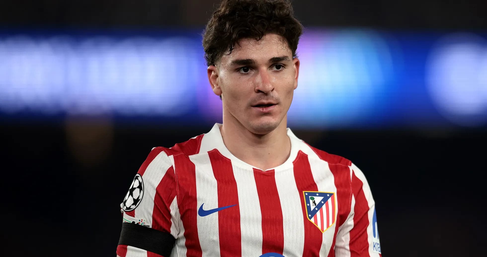 Atletico Madrid player in red and white jersey