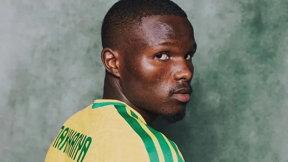 Player in yellow jersey looking over shoulder