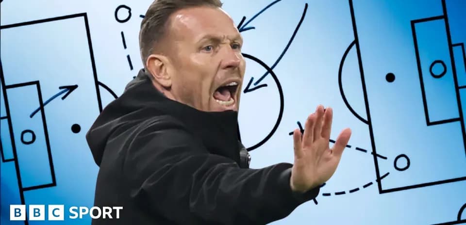 Coach gesturing during tactical discussion on board