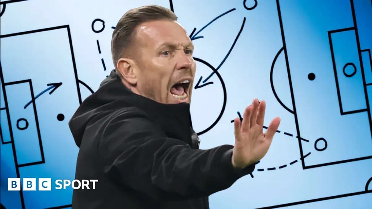 Coach gesturing during tactical discussion on board