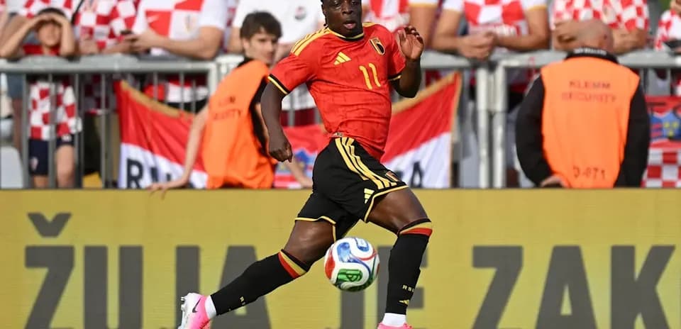 Belgian player dribbling the ball during match