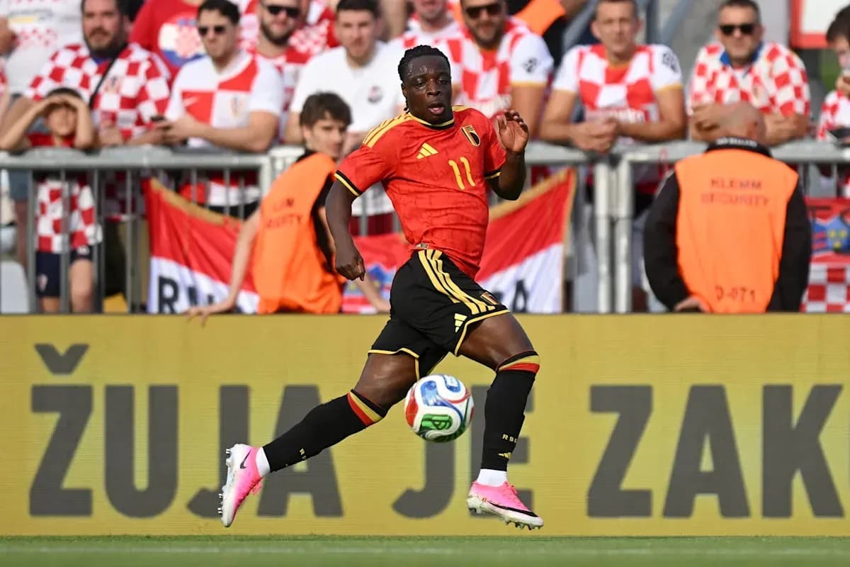 Belgian player dribbling the ball during match
