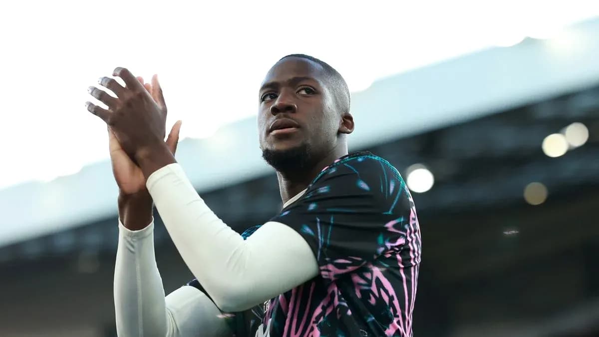 Player applauding fans in vibrant training kit