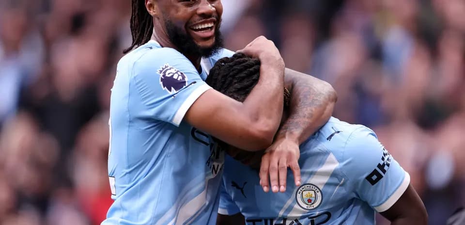 Manchester City players celebrating a goal