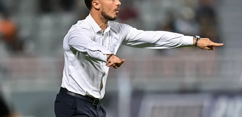 Coach directing players during a match from sidelines