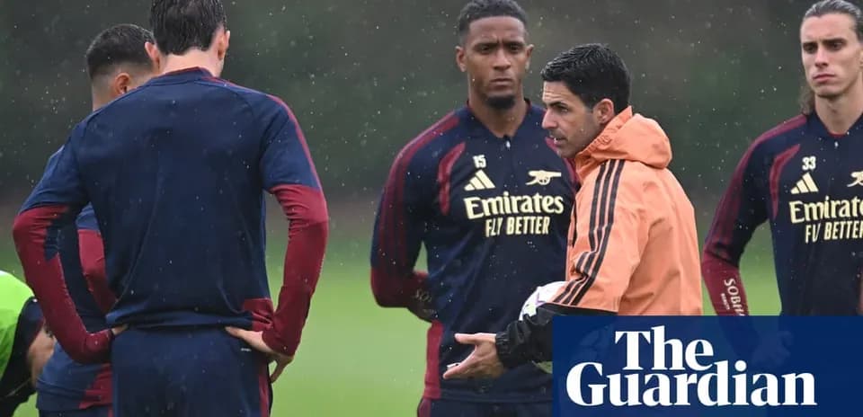 Manager instructing players during training session