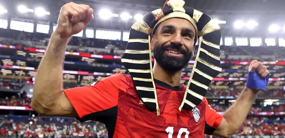 Player celebrating with Pharaoh headdress after match