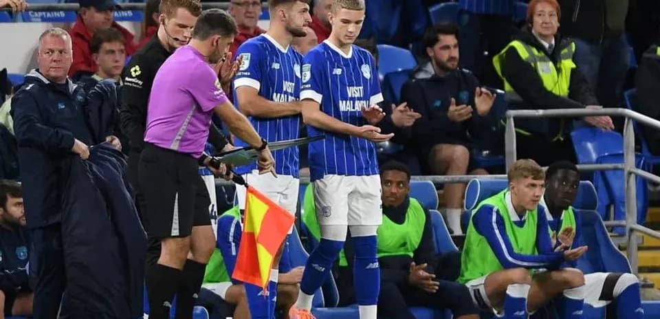Player being substituted during a football match