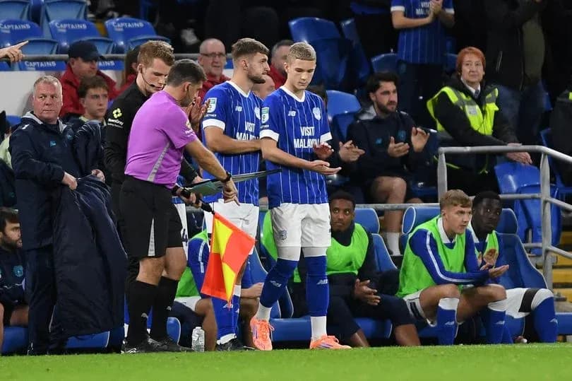 Player being substituted during a football match