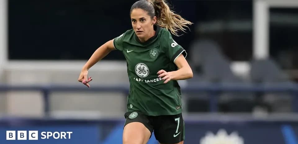 Player in green jersey running on the pitch