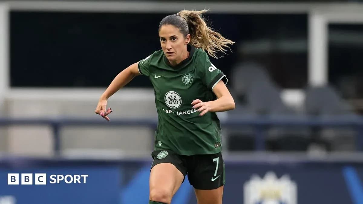 Player in green jersey running on the pitch