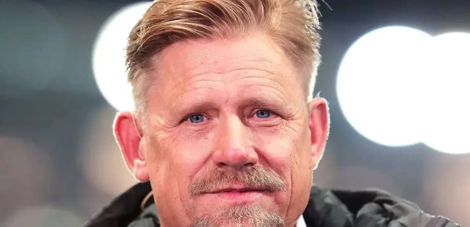 Man with light hair and beard, wearing jacket