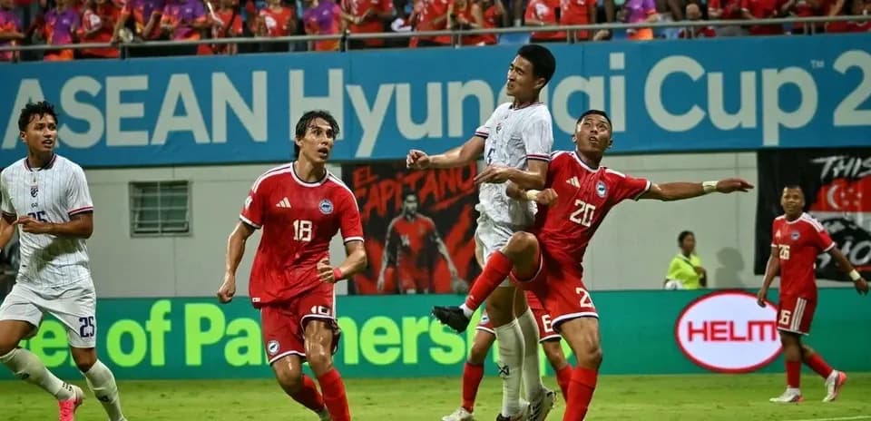 Players contesting for the ball during a match