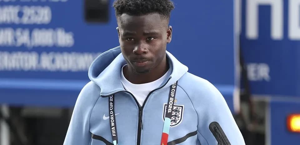 Player arriving at venue wearing team jacket