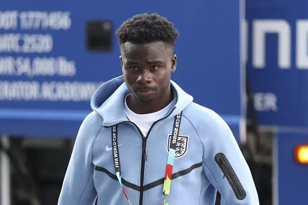 Player arriving at venue wearing team jacket
