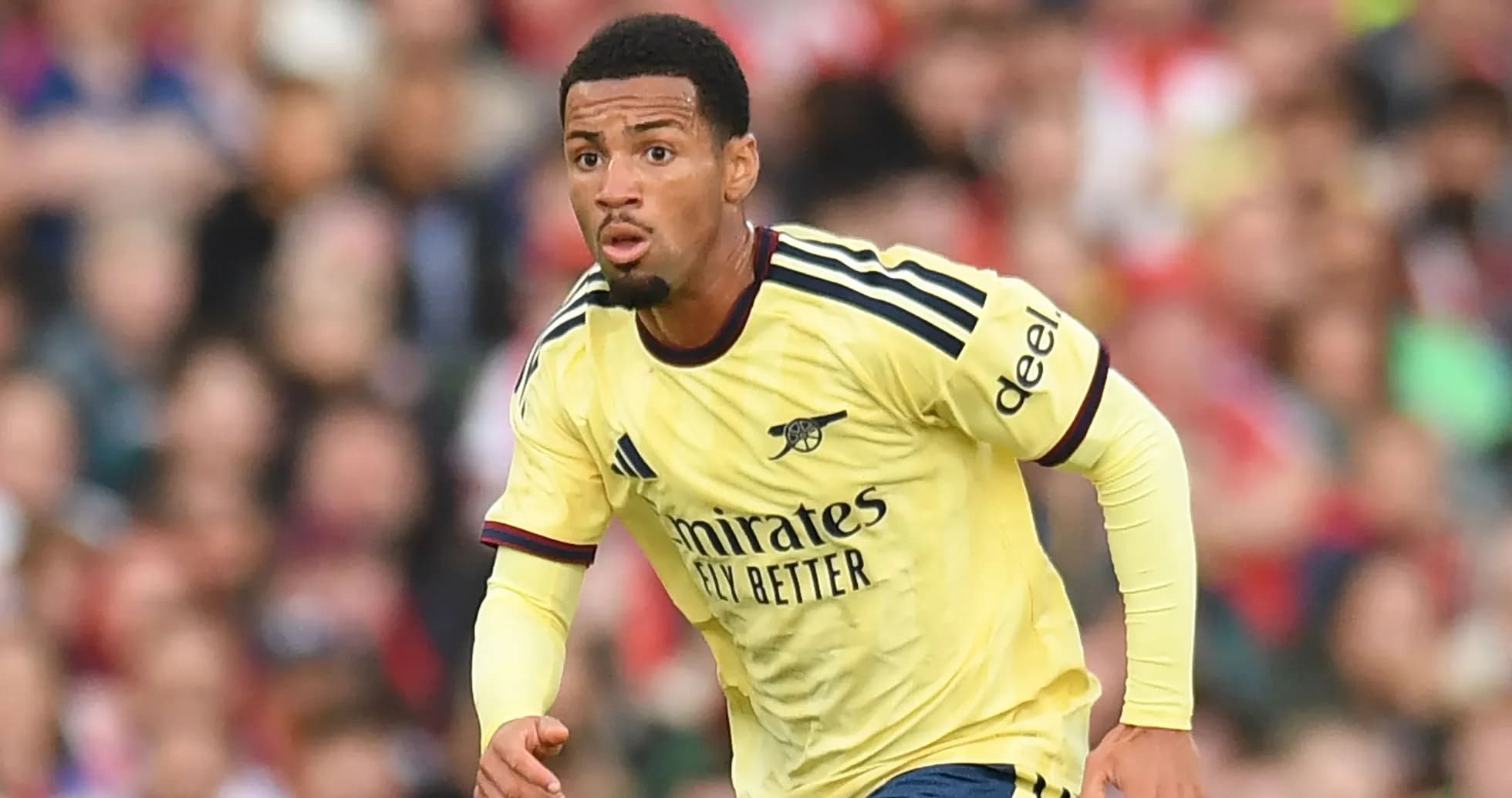 Player in Arsenal kit running during a match