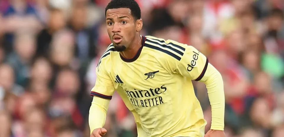 Player in Arsenal kit running during a match