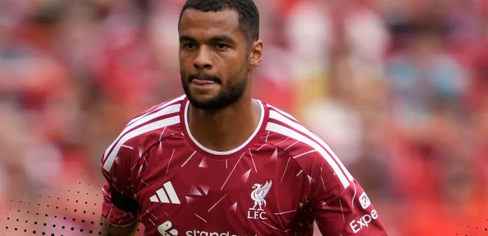 Player wearing Liverpool kit on the pitch
