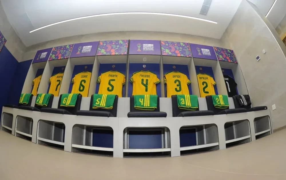 Football jerseys hanging in team locker room